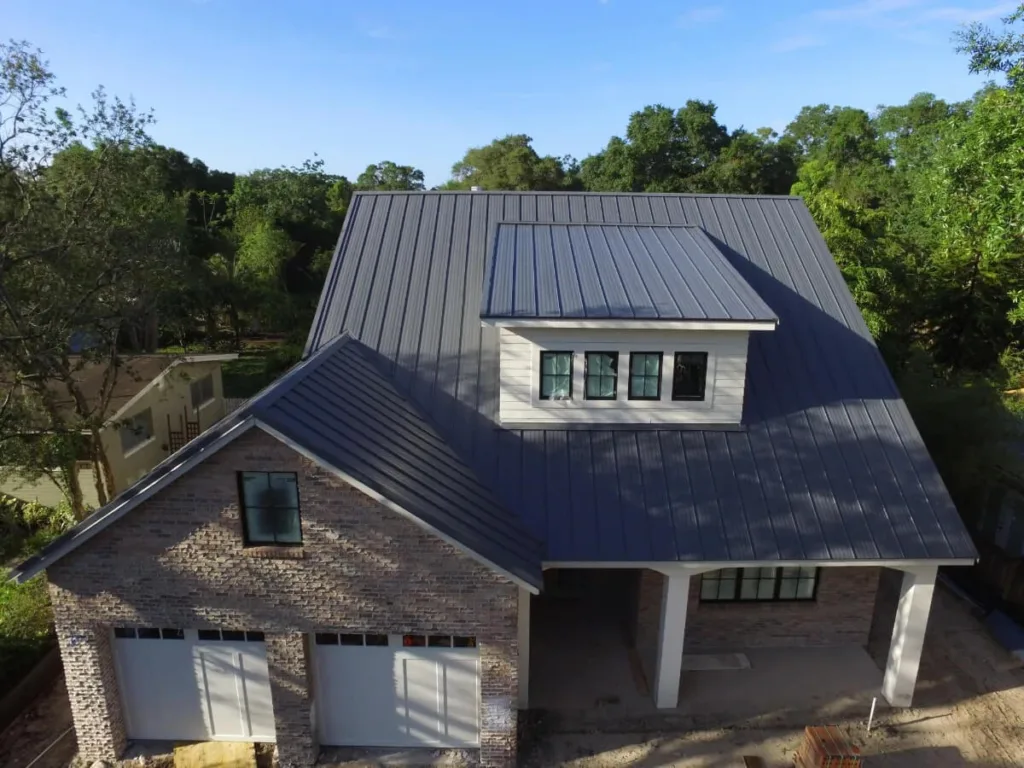 Picture of a house where the roof is the focus, shot with a drone.