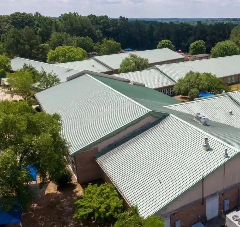 Aerial view of green-gray roof - Lindholm Exteriors